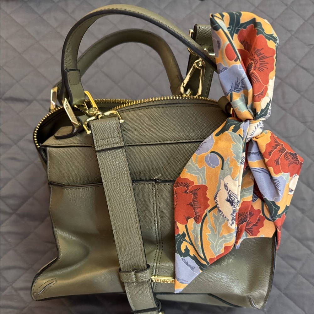 Steve Madden small purse has handles and long shoulder strap.